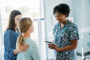 Dentist advising patient