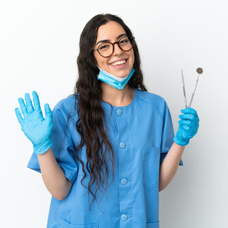 Young,Woman,Dentist,Holding,Tools,Isolated,On,White,Background,Saluting Young,Woman,Dentist,Holding,Tools,Isolated,On,White,Background,Saluting