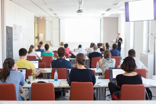 Workshop,At,University.,Rear,View,Of,Students,Sitting,And,Listening